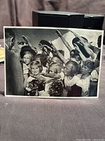 Front view of cigarette card showing children saluting