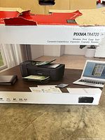 Retail box front showing Canon PIXMA TR4720 imagery and model details