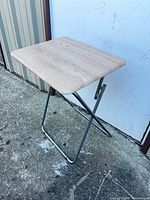 Table open showing laminate surface and metal legs