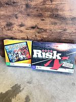 Risk and Stratego board games side by side