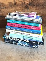 Stack of all ten books showing spines and titles