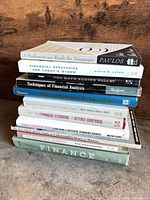 Stacked side view showing most spines with six readable titles