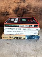 Stack view of all four paperback books showing spines