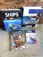 Front covers of all four books visible