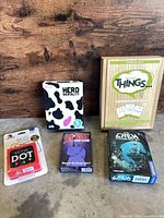 All five game boxes and blister pack overview