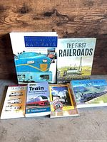 All six railroad books standing and laid out