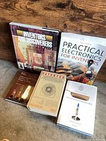 All five books front covers visible