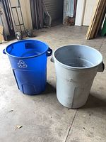 Blue and gray Rubbermaid bins side by side