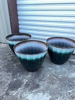 All three matching plastic planters side by side