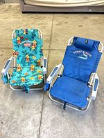 Front view of both chairs upright showing colors, frames, logos