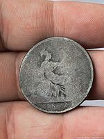 Reverse of 1862 penny showing seated Britannia with surface wear