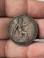 Reverse showing Britannia, date 1921, wording ONE PENNY