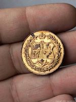 Obverse showing Canadian shield under crown, maple wreath, date 1927