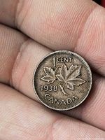 Reverse of 1938 Canada 1-cent coin showing maple leaves and date