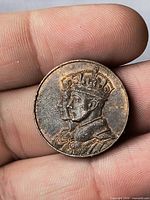 Obverse showing crowned double portrait of King George VI and Queen Elizabeth