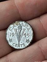 Reverse showing CANADA, 1945, large V with torch, maple leaves