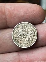 Reverse of 1958 sixpence with floral design and date
