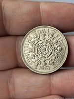Reverse side of 1967 two shilling coin showing floral design and date