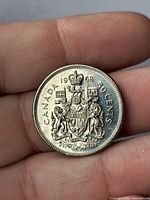 Reverse showing CANADA 1968 50 CENTS with Coat of Arms