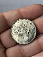 Reverse side showing CANADA DOLLAR legend, Voyageur canoe design, date 1972