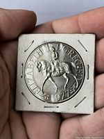 Queen Elizabeth II on horseback, date 1977 visible