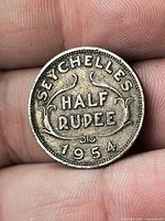 Reverse of 1954 Seychelles half rupee showing SEYCHELLES HALF RUPEE 1954 inscription