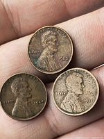 Obverse of three Lincoln cents showing dates 1980, 1944, 1917