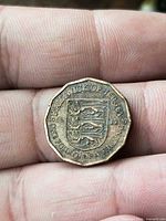Reverse of Jersey quarter shilling showing coat of arms and date