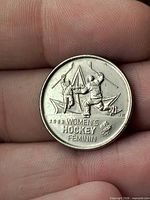 Reverse side with women’s hockey design, Olympic logo and 2002 reference