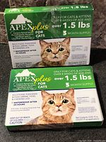 Front view of two sealed Apex Plus for Cats boxes