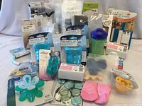 Overview of all packaged baby items spread on table