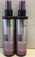 Front view of two identical Pureology Color Fanatic leave-in spray bottles