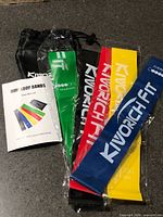 All five resistance bands, pouch and manual displayed
