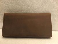Front view of brown leather long bifold wallet closed