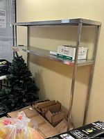 Full view of stainless steel shelving unit against wall