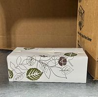 Box of assembled carton beside shipping carton