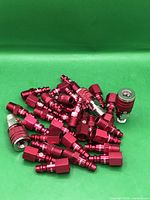 Pile of red ColorConnex couplers and plugs