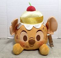 Front view of Stitch pineapple upside-down cake plush showing facial features and hat