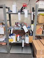 Full view of grey metal shelving unit with five shelves