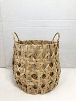 Front view of basket showing weave pattern and handles