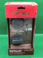 Front of sealed Tough Guard deadbolt lock retail box