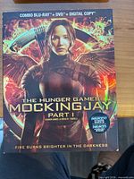 Front cover of The Hunger Games: Mockingjay Part 1 combo pack