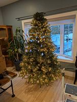 Tree fully assembled and lit showing overall condition and lighting