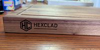 Side view showing HexClad logo on board edge