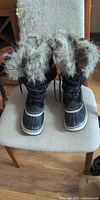 Front view of both boots showing overall style and faux fur collar