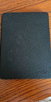 Front of closed Kindle showing textured black cover