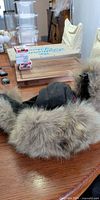 Full view Canada Goose hat with fur trim on table