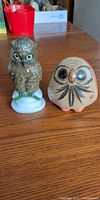 Both owl figurines side by side