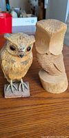 Both owl figurines side by side on tabletop