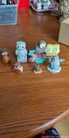 Group shot of all six owl figurines